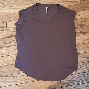 Athleta Tee shirt good condition has some wear. Color Mocha.